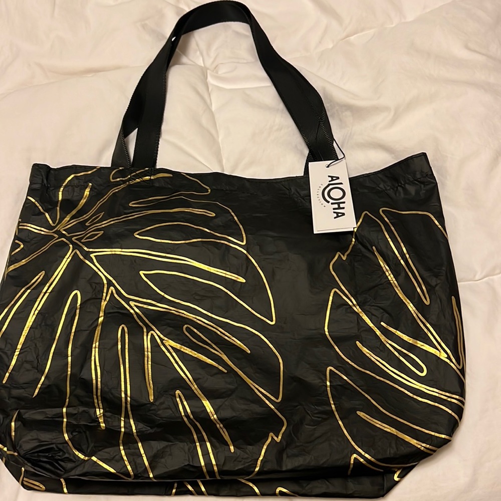 Aloha Collection tote bag.  Brand new with tags.   Reversible splash proof